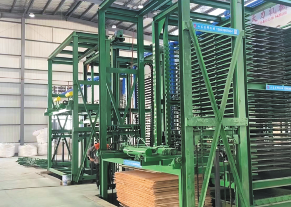 1725628763934868.png 熱壓機(jī)自動(dòng)進(jìn)出應(yīng)用現(xiàn)場(chǎng).png